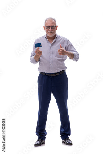 Old businessman holding credit card isolated on white