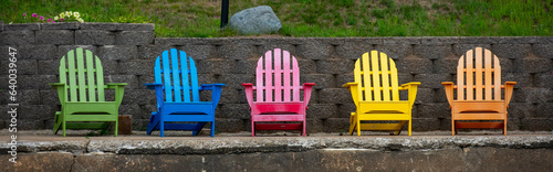 Obraz na plátně Colorful adirondack chairs on a Wisconsin lake deck