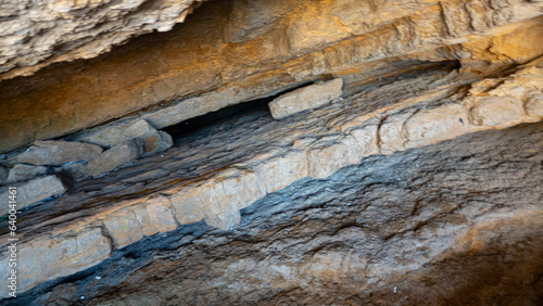 close-up metamorphic rock in layers in cave