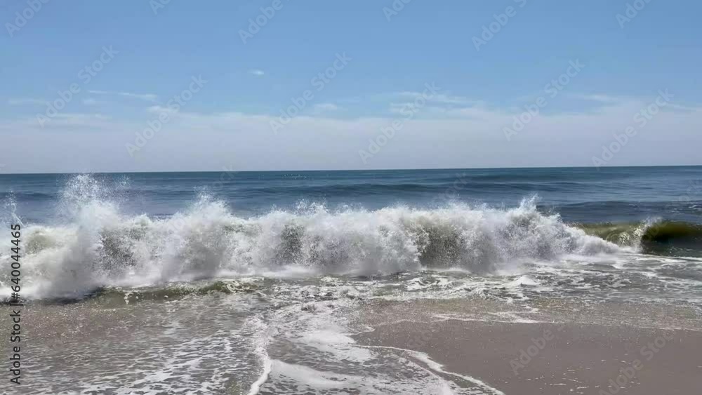 Front view of waves forming and rolling in in the Atlantic Ocean off the coast of Fire Island Long Island New York Front view of waves forming and rolling in in the Atlantic Ocean off the coast of Fire Island Long Island New York
