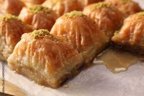 Delicious sweet baklava with pistachios on table, closeup © New Africa