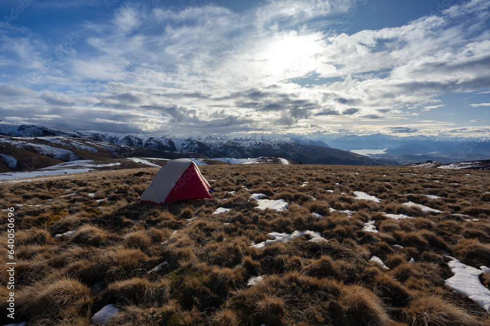 Camping in New Zealand mountain landscape during the winter at sunset near Wānaka and Queenstown