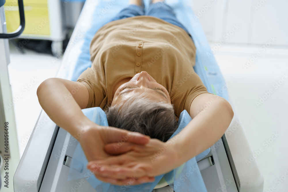 Patient entering CT machine during examination procedure in hospital. High quality photo Patient entering CT machine during examination procedure in hospital. High quality photo