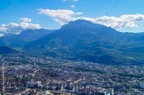 Aerial view of Grenoble old town seen from Bastille Fort, Auvergne-Rhone-Alpes region, France, Europe. View from above on the Isere Valley in the French Pre-Alps. Chartreuse Belledonne mountain range © Chris