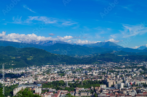 Aerial view of Grenoble old town seen from Bastille Fort, Auvergne-Rhone-Alpes region, France, Europe. View from above on the Isere Valley in the French Pre-Alps. Chartreuse Belledonne mountain range