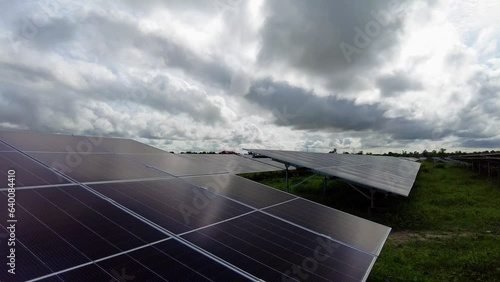 Descending tilt down shot from the sky to a solar photovoltaic farm which is unveiled for sustainable power supply and better environment in Jambur in Gambia photo