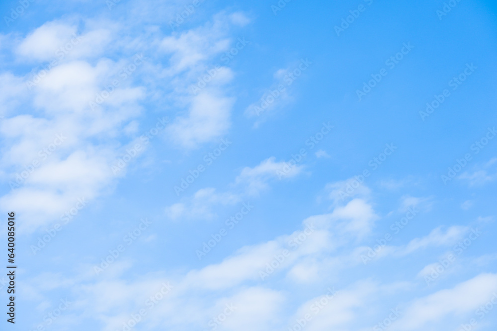 Obraz premium beautiful blue sky and white fluffy group of clouds with sunrise in the morning, natural background