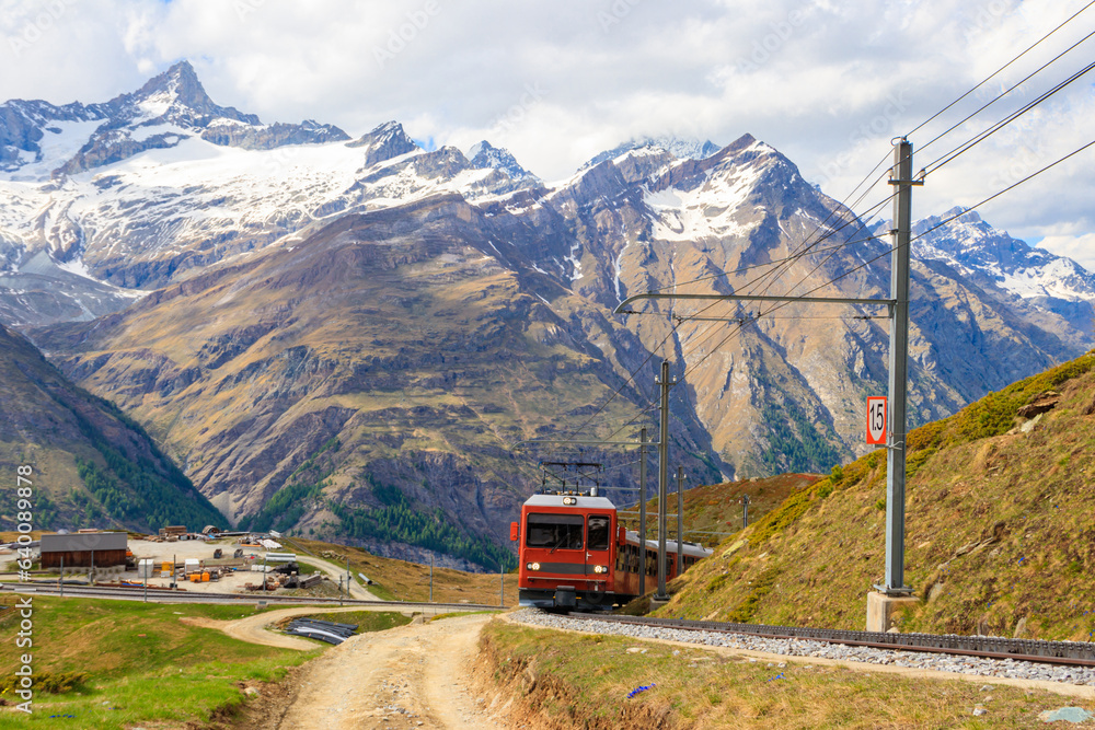 Beautiful view of the Swiss Alps with cogwheel train of Gornergrat railway close to Zermatt, Switzerland