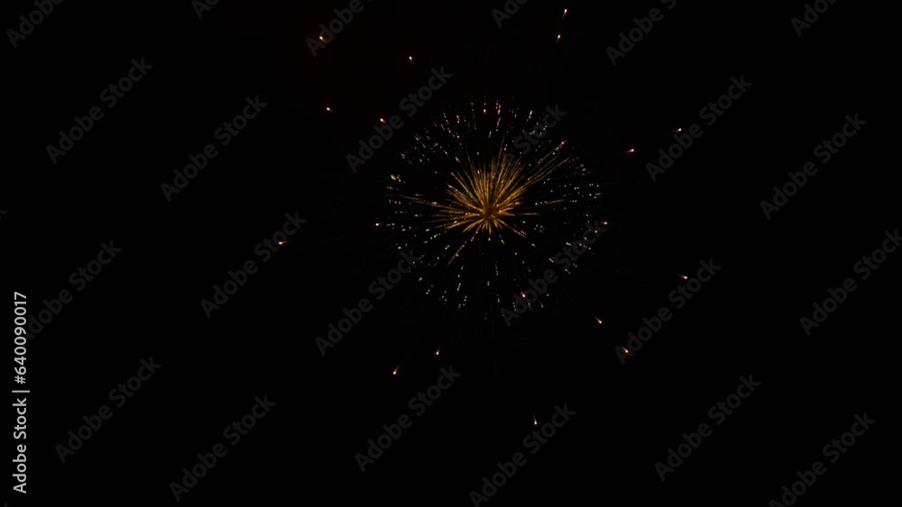 Fireworks explode in dark night sky, beautiful slow motion shot Fireworks explode in dark night sky, beautiful slow motion shot