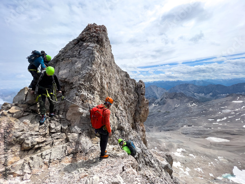 Hiker to Zugspitze by using the via ferrata hike trail path photo