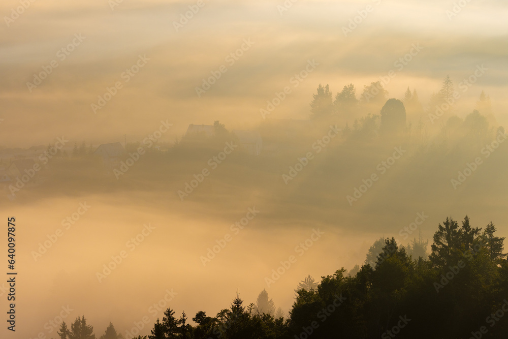 Dawn with golden morning mist in a mountain valley, Croatia Dawn with golden morning mist in a mountain valley, Croatia