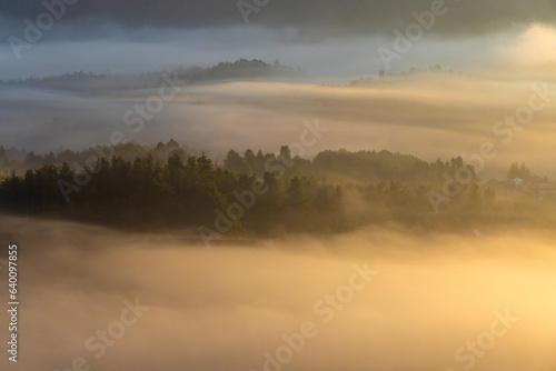 Fototapeta Naklejka Na Ścianę i Meble -  Dawn with golden morning mist in a mountain valley, Croatia