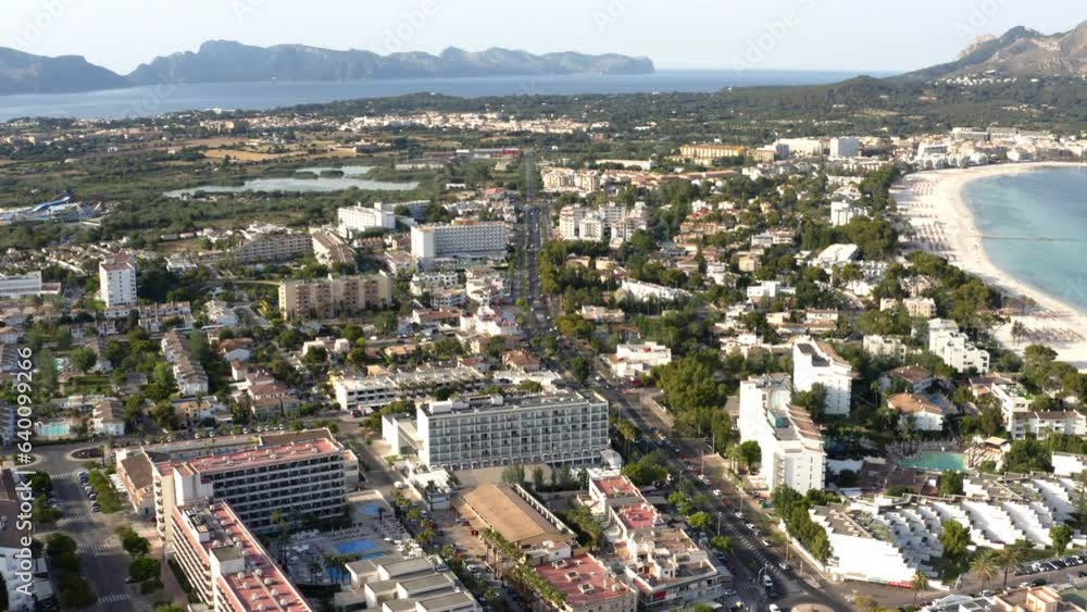 Alcudia city on coast of Mallorca with car traffic on main street. Alcudia city on coast of Mallorca with car traffic on main street.