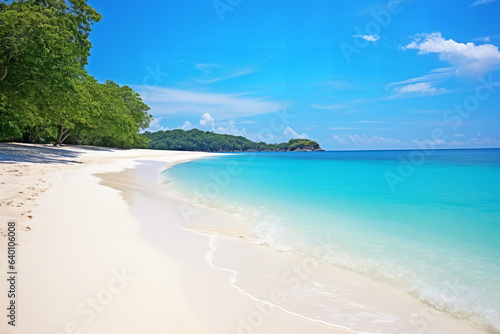 A secluded beach with crystal-clear blue waters and white sand. © Nate