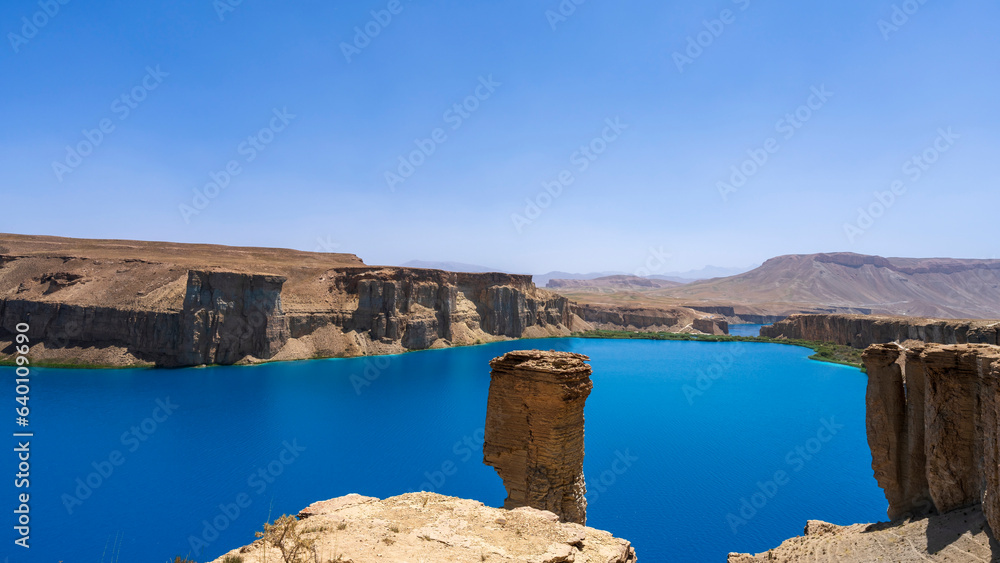 Band-e-Amir Lake and National Park in Afghanistan. High mineral content makes the lake intensely blue and thus popular tourist attraction. A hardened mineral travertine surrounds the lake.