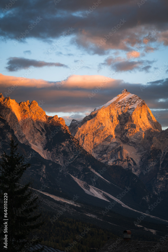 High angle of orange mountain peak at sunset in The Dolomites South Tyrol Italy
