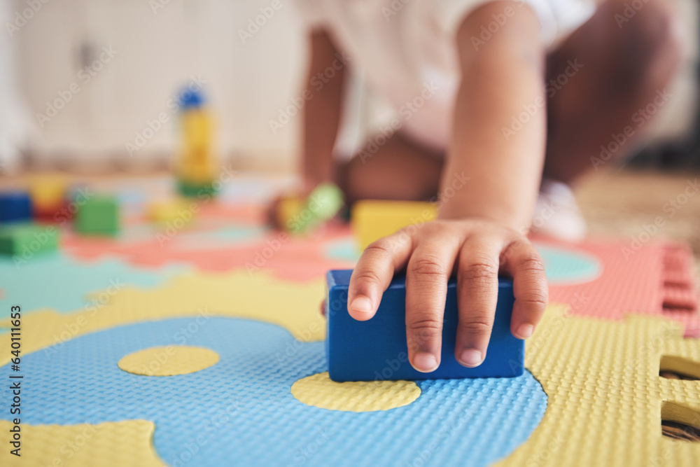 Building blocks, hands and toddler at daycare with development on number carpet and ground. Learning, baby and toy with nursery, motor skills and child game at kindergarten with youth and cube - obrazy, fototapety, plakaty 