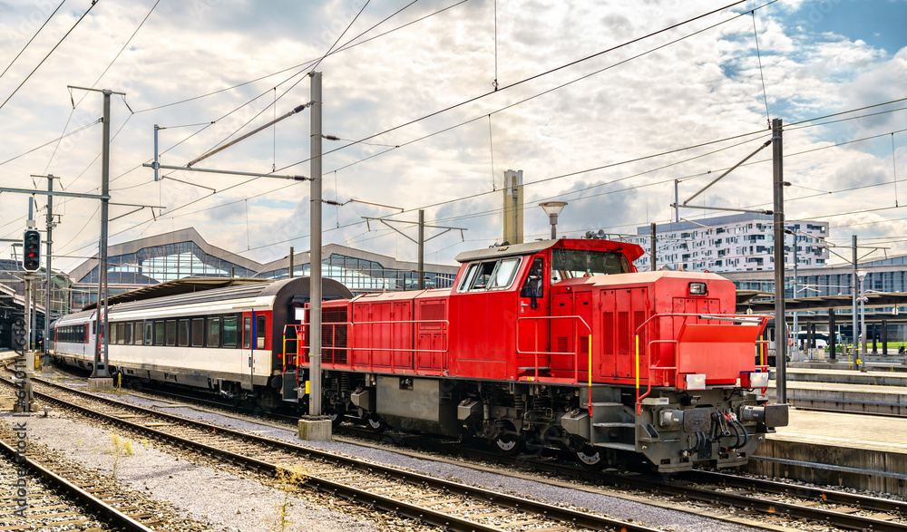Switcher locomotive with passenger wagons at Basel Station in Switzerland