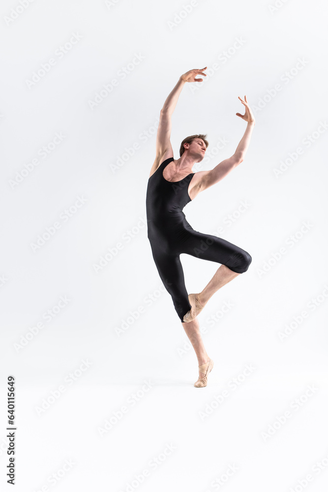 Ballet Dancer Young Man in Black Dance Suit Posing in Ballanced Dance Pose Studio On White.
