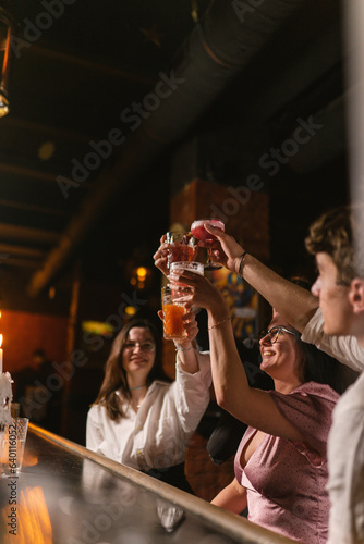 фотографія Close friends cheer alcohol and have good time together