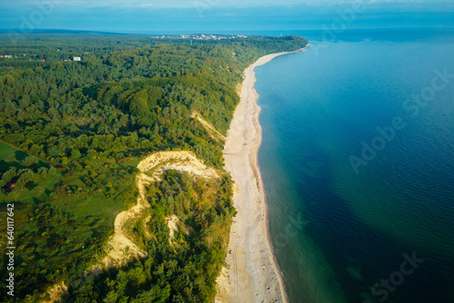 Aerial view of sea landscape with sand beach in Wladyslawowo. Baltic sea coastline in Poland. Resort town in summer season