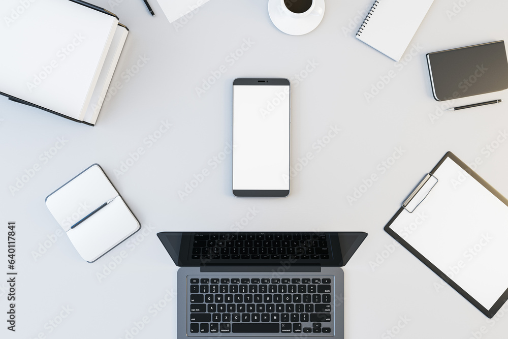 Top view and close up of white office desk top with supplies, devices and mock up place for your advertisement. 3D Rendering. Top view and close up of white office desk top with supplies, devices and mock up place for your advertisement. 3D Rendering.