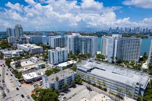 Miami Beach, Florida, USA - Aerial of Luxury mid-rise condominium at South Beach facing Biscayne Bay and the downtown Miami skyline. photo