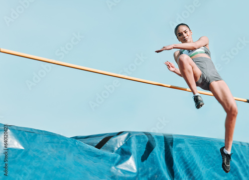 High jump, woman and sport with exercise, cardio and athlete in competition outdoor. Jumping, workout and training for performance with action, energy and contest with female person and mockup space
