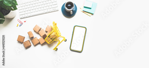 Business ecommerce with retail store or online shopping,concepts.smartphone and shoppy cart and small product box mockup.seller and buyer. photo