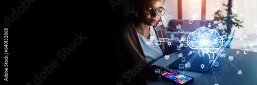 Young Black woman working in office and AI(Artificial Intelligence) concept. Wide angle visual for banners or advertisements. photo