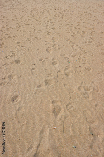 Abstract background beach sand with foot print marks