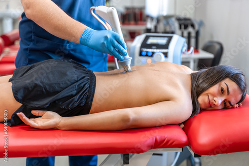 Extracorporeal shockwave therapy, physical therapy for neck and back muscles.