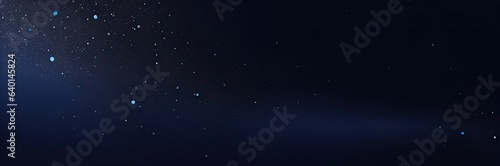 Dark blue background with glowing praticles.