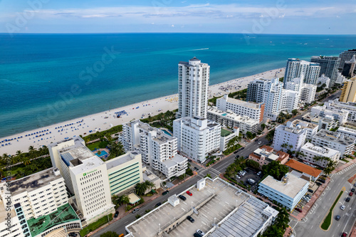 Miami Beach, Florida, USA - Aerial view of luxury apartments and hotels and the boardwalk stretching from Mid - Beach going north.