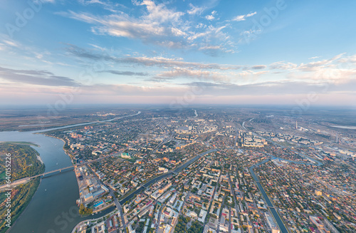 Astrakhan, Russia. Panorama of the city from the air in summer. Volga river. Sunset time. Aerial view