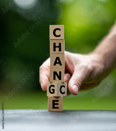 A stack of cubes form the words change and chance.