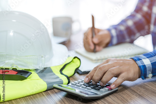 revenue calculation engineer construction costs on the desk.concept of capital analysis Recurring income and expenditure.selective focus
