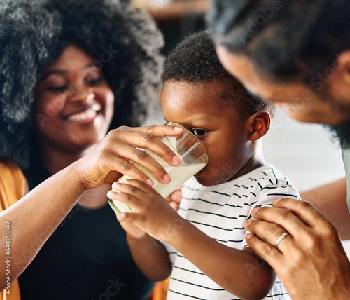 child family kitchen boy son mother father drink breakfast milk healthy drinking food eating glass home black african american father man together love cute childhood photo