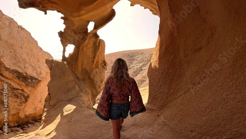 Close up of one happy and free woman enjoying vacations opening arms looking at amazing beautiful landscape and background. Freedom having fun concept lifestyle.
