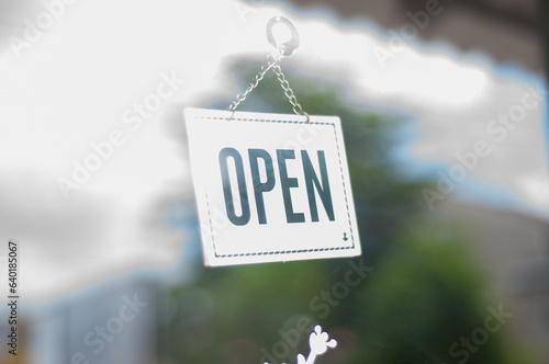 open sign in front of a shop