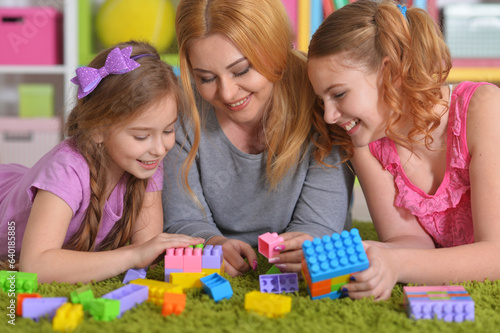  family playing with blocks together