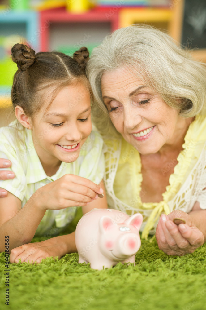 Portrait of a old woman with piggy bank Portrait of a old woman with piggy bank