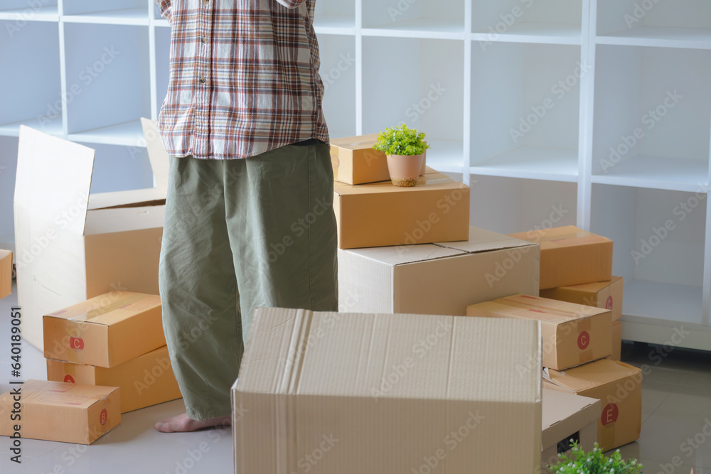 Happy Asian man carrying their while relocating into new apartment. Happy Asian man carrying their while relocating into new apartment.