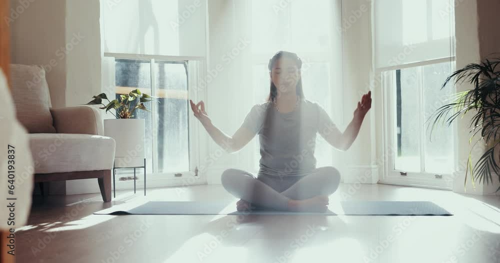Yoga, meditation and woman in home with wellness, zen and breathing for health in a bedroom. Namaste, holistic and calm female person in a house on the floor with mindfulness and arm stretching Yoga, meditation and woman in home with wellness, zen and breathing for health in a bedroom. Namaste, holistic and calm female person in a house on the floor with mindfulness and arm stretching