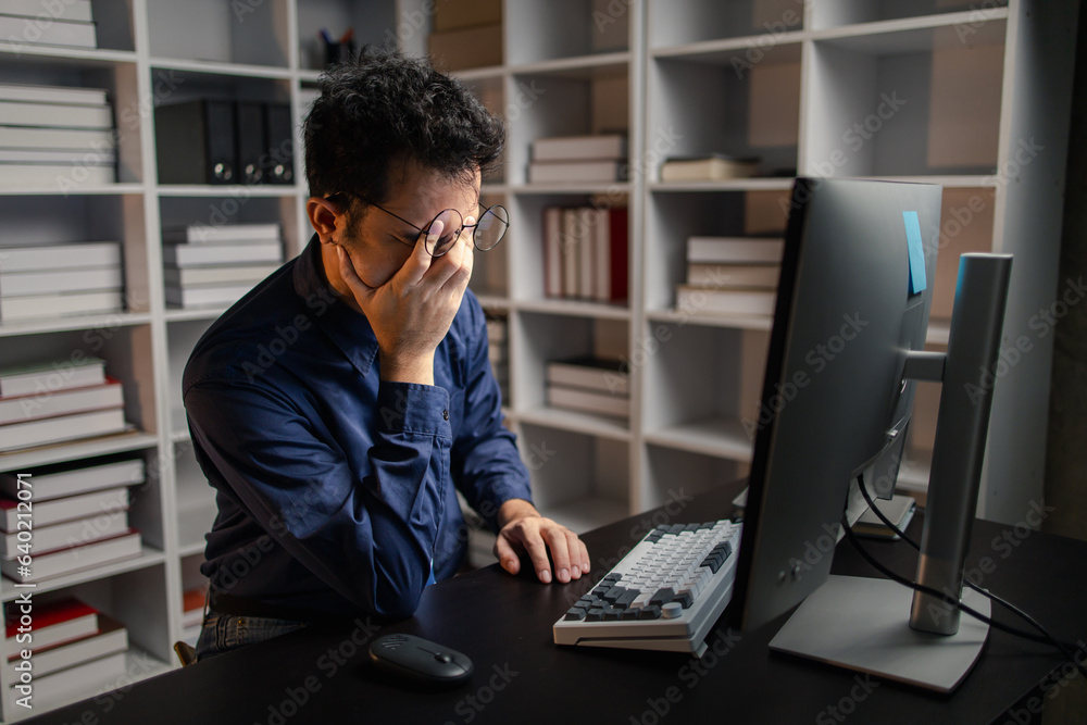 Startup company employees work overtime and work hard causing stress and fatigue from work, office syndrome, exhausting work makes the body tired. Overtime concept and office syndrome. Startup company employees work overtime and work hard causing stress and fatigue from work, office syndrome, exhausting work makes the body tired. Overtime concept and office syndrome.