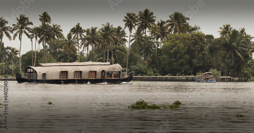 The House boat traditionally built with wood and coir is a major attraction for the travellers visiting Keral backwaters for Eco tourism in Kochi, India. photo