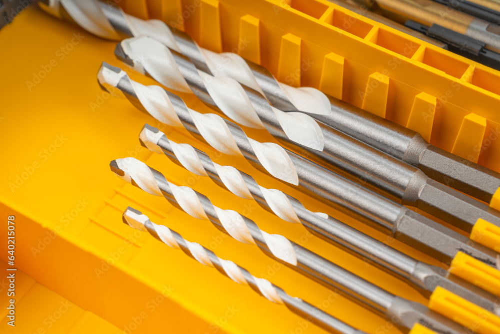 Close-up of Drill bits set professional industrial tools and equipment in box. Close-up of Drill bits set professional industrial tools and equipment in box.