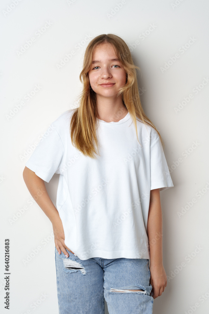 Portrait of young beautiful cute teen girl posing at camera