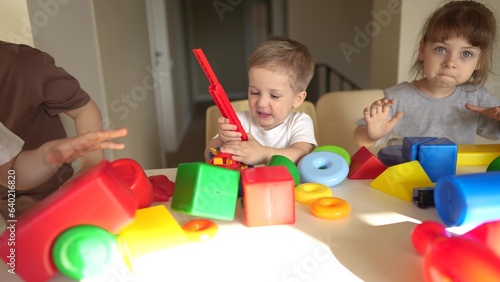 kindergarten. a group of children play toys cubes and cars on the table in kindergarten. kid dream creative happy family preschool education concept. nursery baby toddler home lifestyle