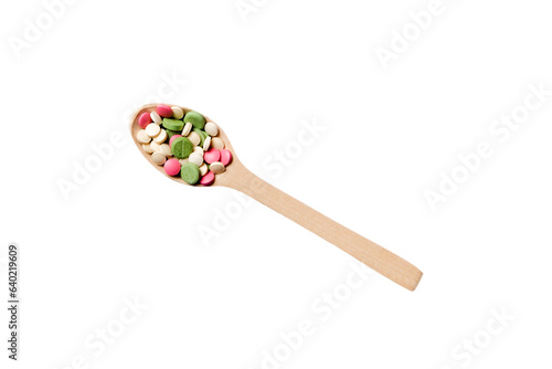 Vitamin capsules in a wooden spoon on a colored background. Pills served as a healthy meal. Drugs, pharmacy, medicine or medical healthycare concept photo